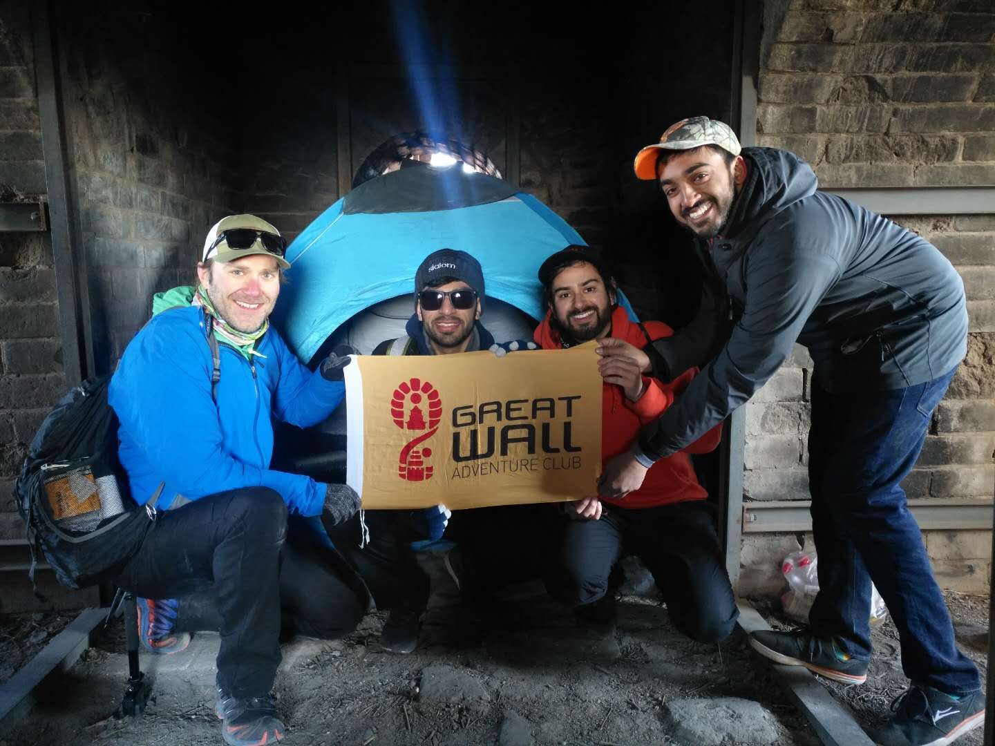 Travelers beside a tent inside a Great Wall watchtower